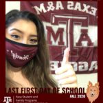 young woman in a mask smiles for a virtual photo booth in front of school flag 