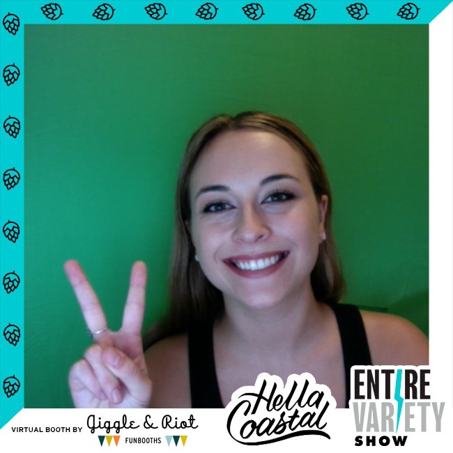 woman smiles with peace sign in virtual photo booth