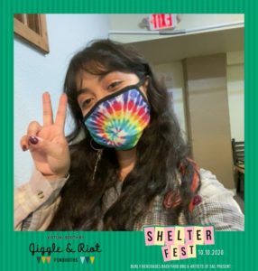 Woman poses with tie dye mask in virtual photo booth