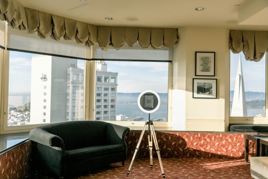 traveling photobooth sits in front of windows in high rise building