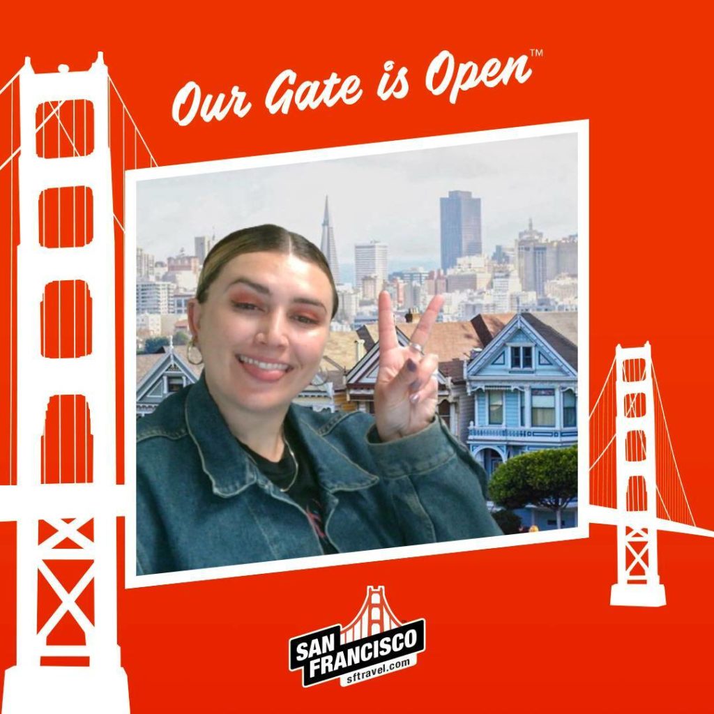 woman smiles for online photobooth for SF travel