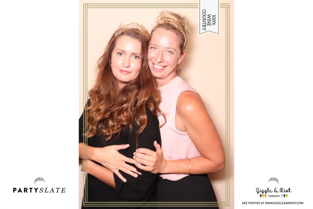2 women pose in photobooth brand launch